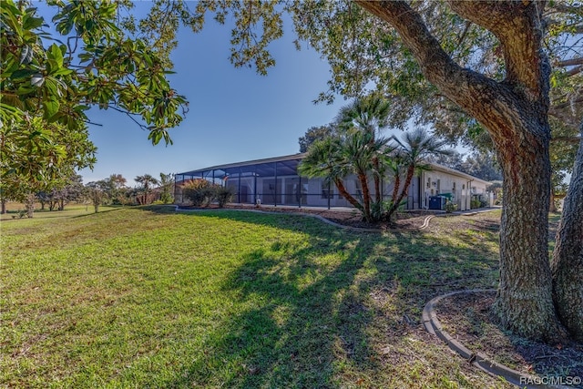 view of yard featuring a lanai