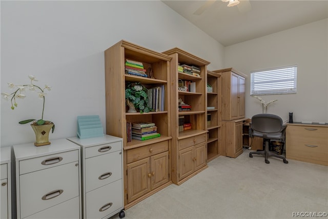 carpeted office space with ceiling fan