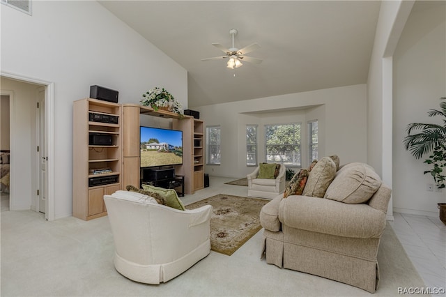 living room with ceiling fan, high vaulted ceiling, and light colored carpet