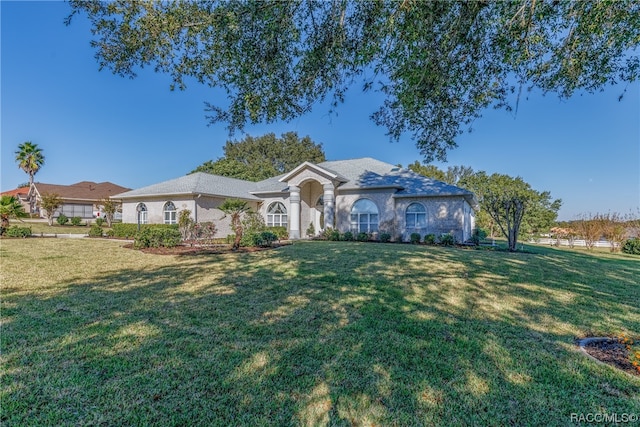 ranch-style house featuring a front lawn