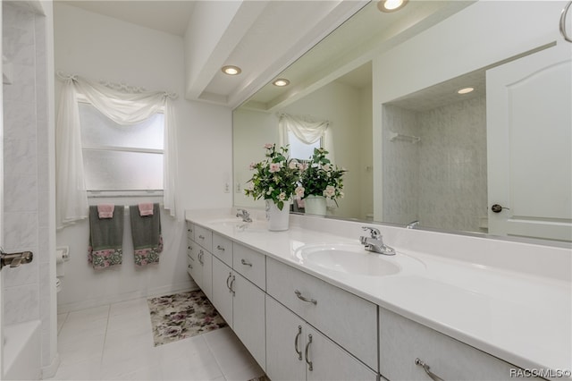 bathroom featuring tile patterned flooring and vanity