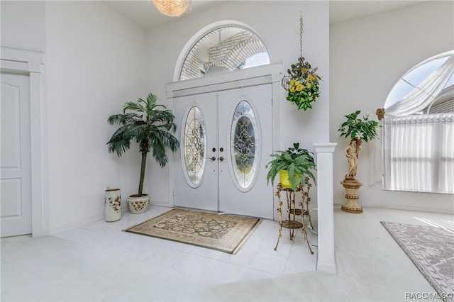 carpeted entryway with french doors