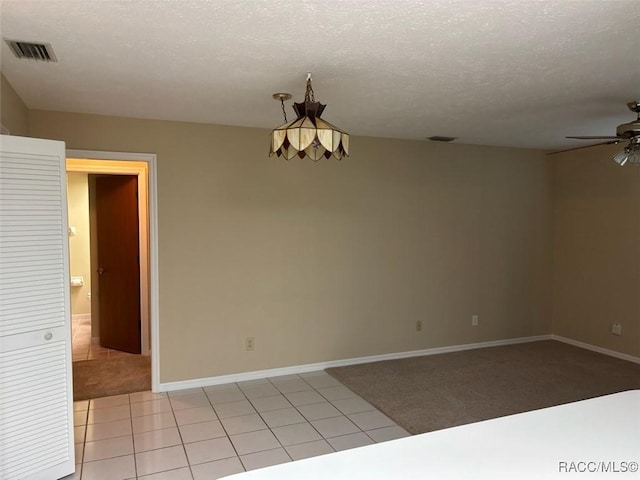 3365 S Crossbill Loop, Inverness, FL 34450 - unfurnished room with ceiling fan, a textured ceiling, and light tile patterned flooring