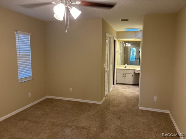3365 S Crossbill Loop, Inverness, FL 34450 - spare room with ceiling fan and light carpet