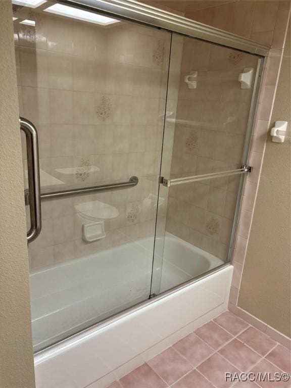 3365 S Crossbill Loop, Inverness, FL 34450 - bathroom with shower / bath combination with glass door and tile patterned floors