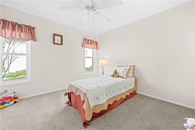 bedroom featuring ceiling fan and carpet