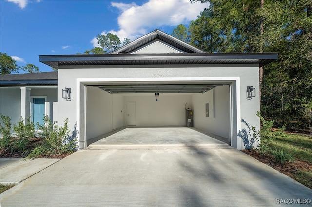 garage with electric panel and water heater