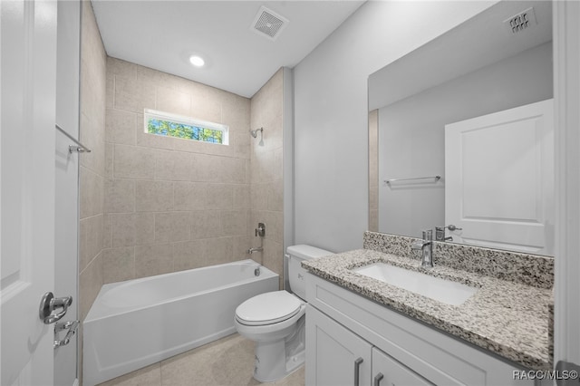 full bathroom with tile patterned floors, vanity, toilet, and tiled shower / bath