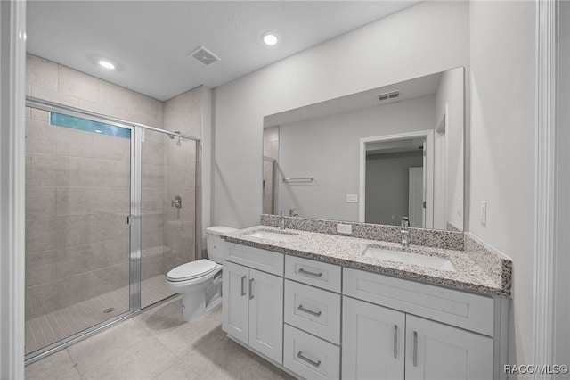 bathroom featuring toilet, vanity, and walk in shower