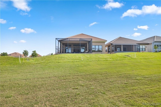 view of yard with glass enclosure