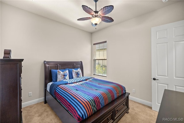 bedroom with light carpet and ceiling fan