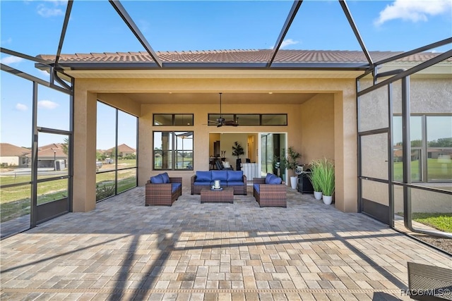 unfurnished sunroom featuring ceiling fan