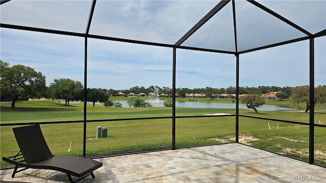 unfurnished sunroom with a water view