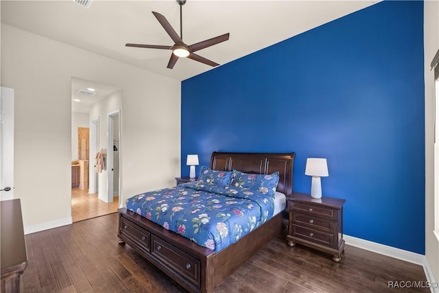 bedroom with ceiling fan and dark hardwood / wood-style flooring