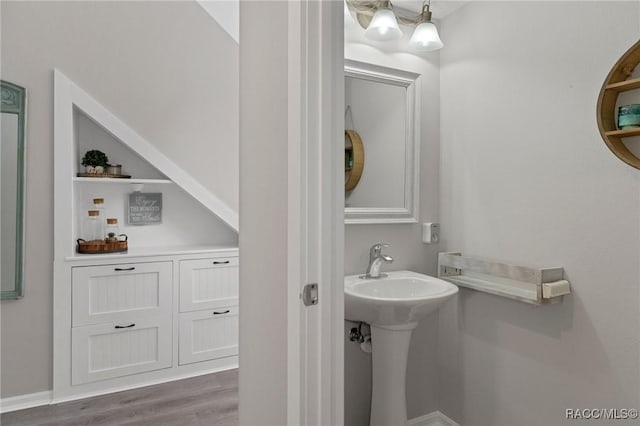 bathroom with sink and wood-type flooring