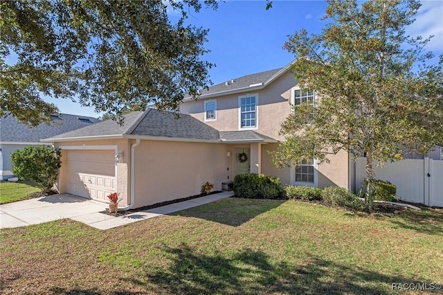 view of front property with a front yard and a garage