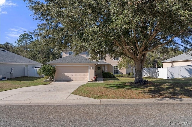 view of front of property with a front lawn and a garage