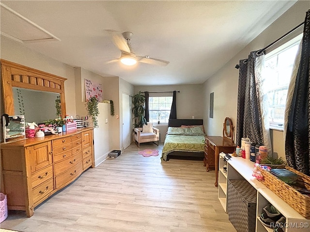 bedroom with ceiling fan and light wood-type flooring