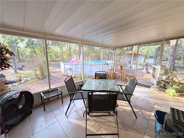 sunroom / solarium with wood ceiling