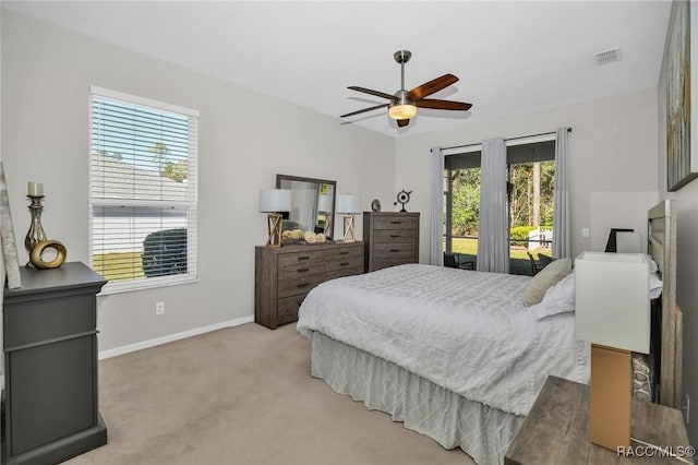 bedroom featuring visible vents, ceiling fan, baseboards, carpet, and access to outside