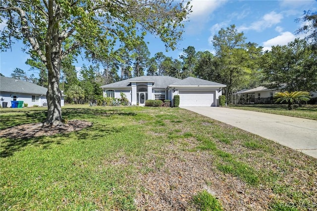 ranch-style home featuring a garage, concrete driveway, and a front yard