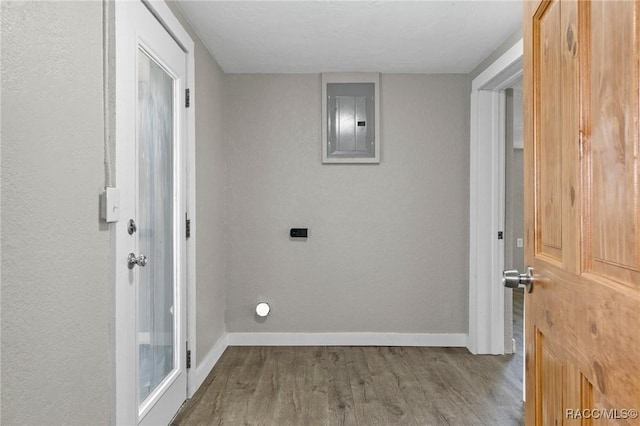 1 Taft St, Beverly Hills, FL 34465 - laundry area featuring electric panel, wood finished floors, and baseboards