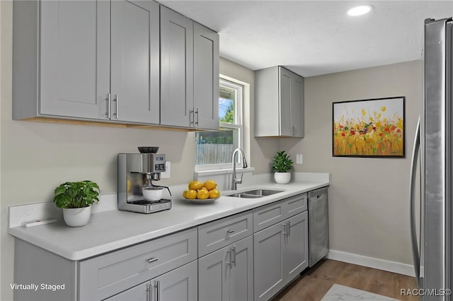 1 Taft St, Beverly Hills, FL 34465 - bar area with a sink, stainless steel appliances, dark wood-style flooring, and baseboards