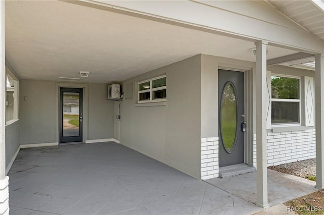 1 Taft St, Beverly Hills, FL 34465 - entrance to property featuring an attached carport, stucco siding, a patio area, and brick siding
