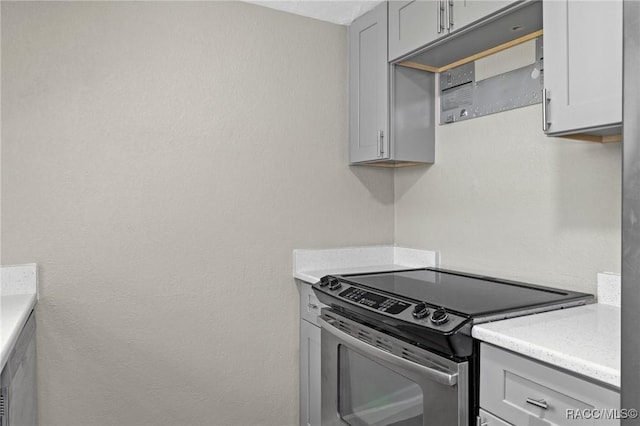 1 Taft St, Beverly Hills, FL 34465 - kitchen with stainless steel range with electric stovetop and gray cabinets