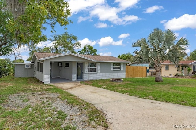 1 Taft St, Beverly Hills, FL 34465 - view of front of property featuring concrete driveway, brick siding, a carport, and stucco siding