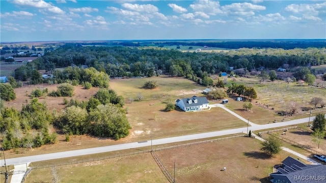 birds eye view of property with a rural view