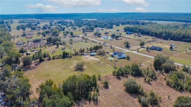 birds eye view of property with a rural view