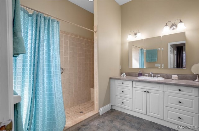 bathroom with vanity, curtained shower, and tile patterned floors