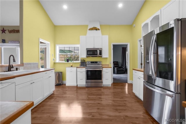 kitchen featuring sink, dark hardwood / wood-style floors, white cabinets, and appliances with stainless steel finishes