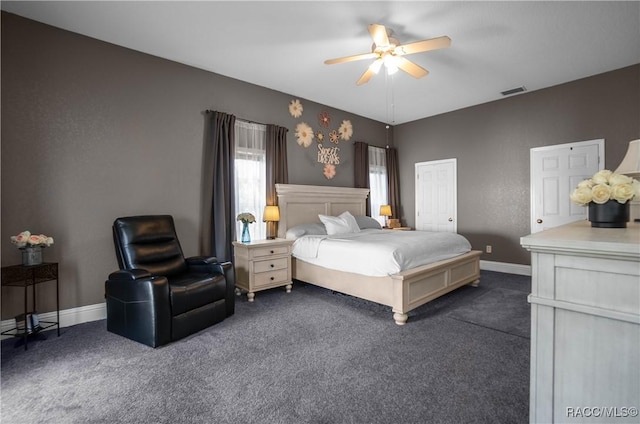 bedroom featuring dark carpet and ceiling fan