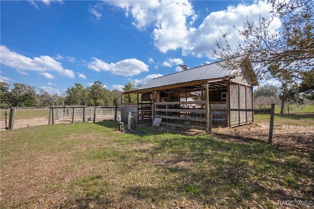 view of outdoor structure with a rural view