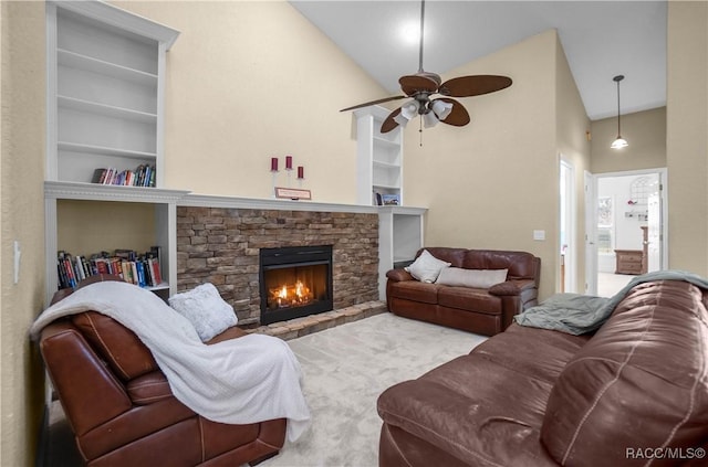 living room featuring built in features, ceiling fan, high vaulted ceiling, carpet, and a fireplace