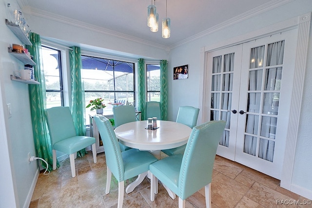 dining space featuring french doors and ornamental molding