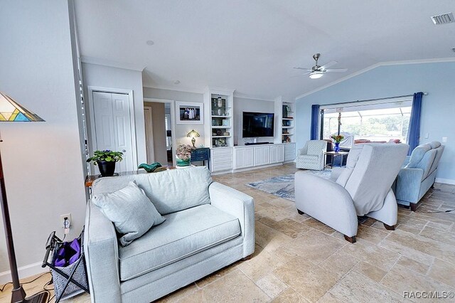 living room with crown molding and an inviting chandelier