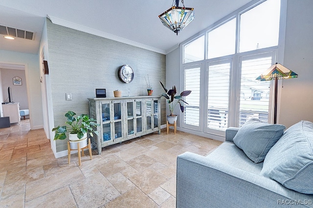 living room featuring a wealth of natural light, crown molding, and vaulted ceiling