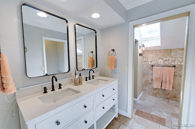 bathroom with vanity and crown molding