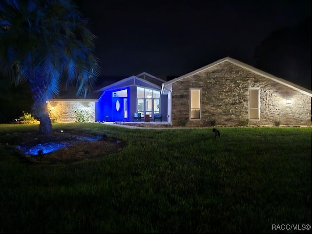 view of front of property with a yard