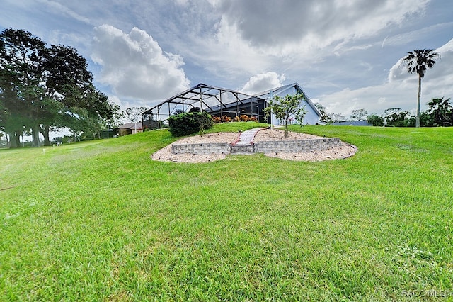 view of yard featuring glass enclosure