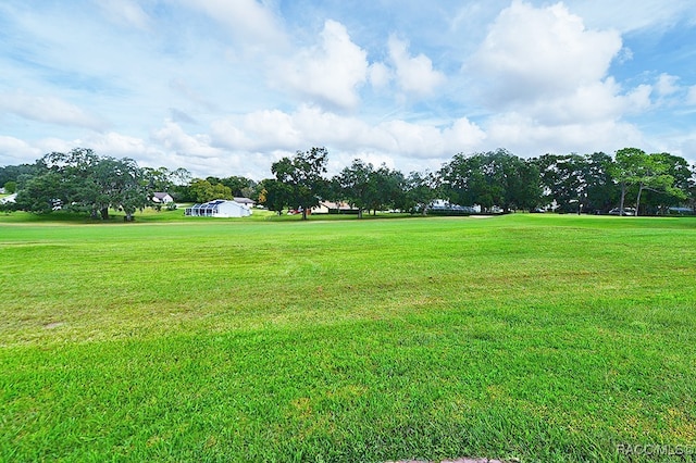 view of home's community featuring a lawn