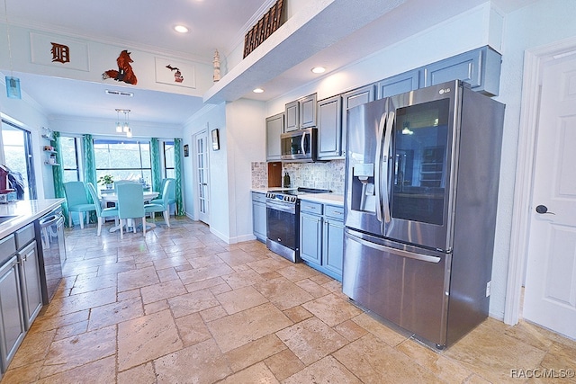 kitchen featuring appliances with stainless steel finishes, tasteful backsplash, crown molding, pendant lighting, and gray cabinets