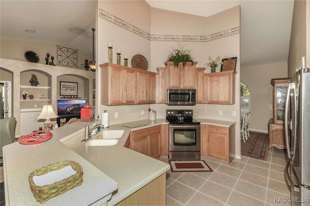 kitchen featuring kitchen peninsula, appliances with stainless steel finishes, sink, high vaulted ceiling, and light tile patterned flooring