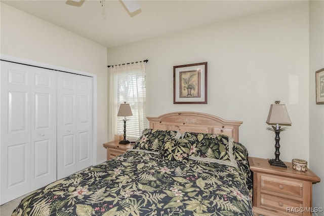 carpeted bedroom with ceiling fan and a closet