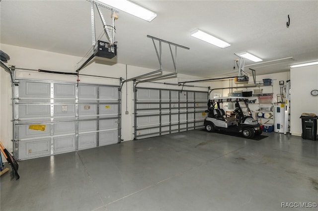 garage featuring a garage door opener and water heater