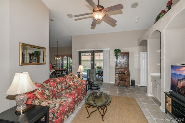 living room with tile patterned floors and ceiling fan