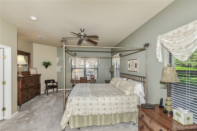 carpeted bedroom with a textured ceiling and ceiling fan